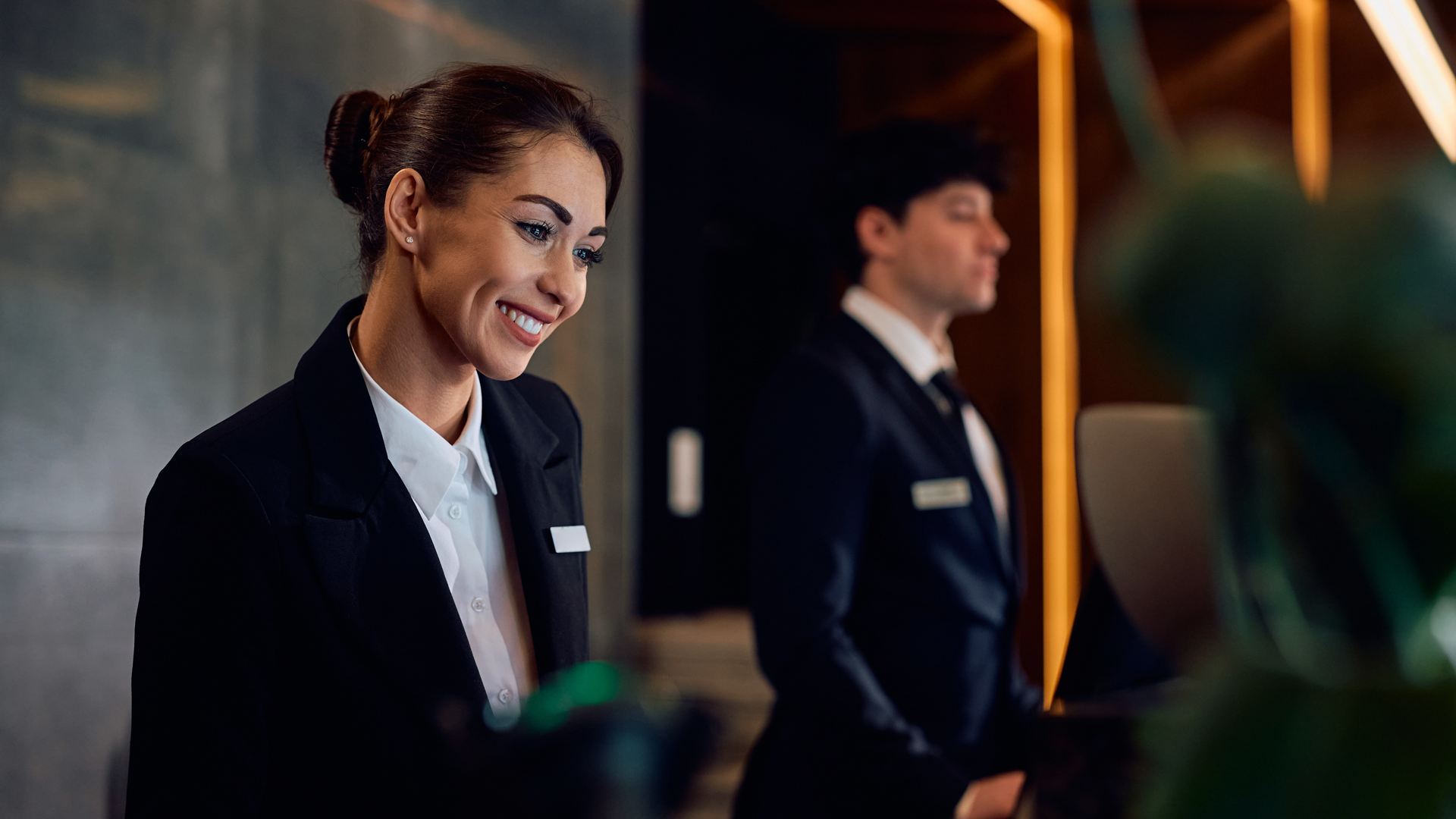 Professional concierge team in modern lobby